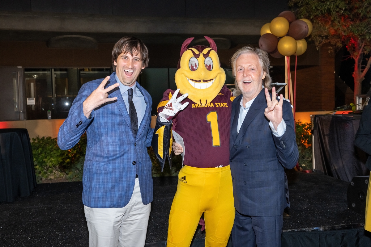 Two men and Sparky make the ASU pitchfork symbol with their hands.