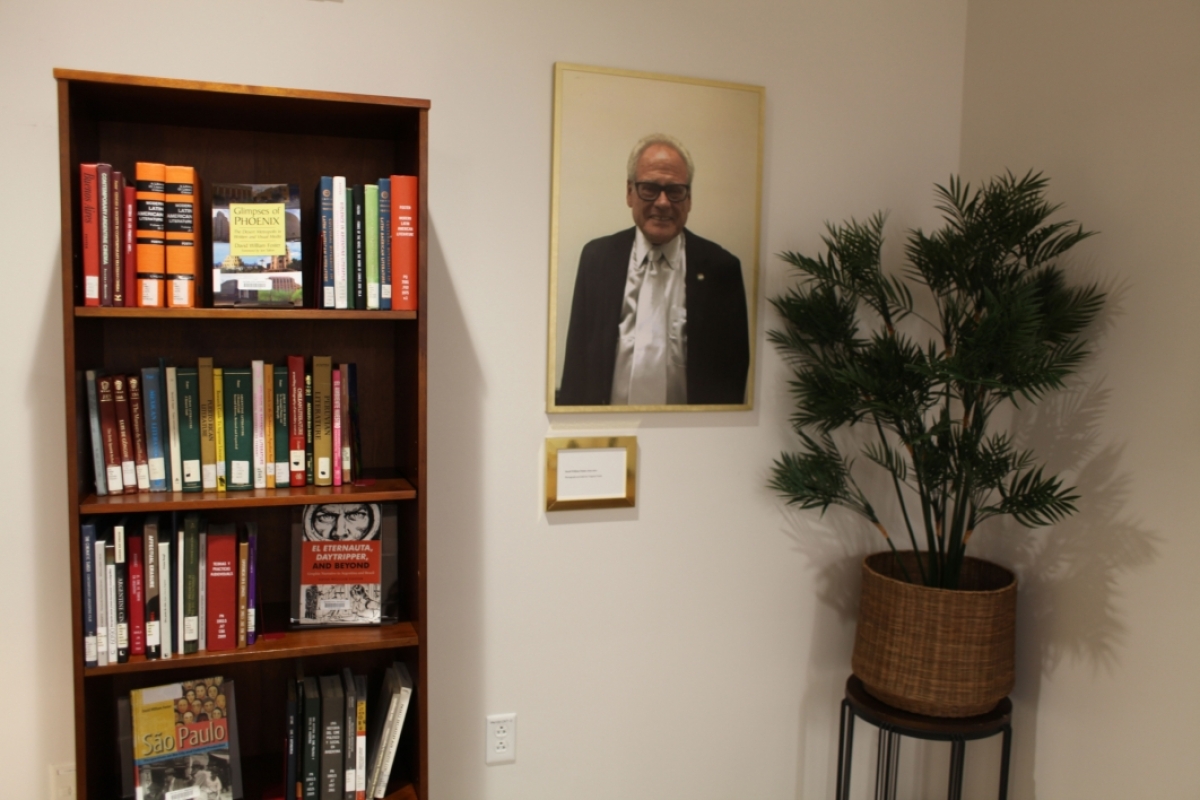 memorial exhibit with photo and bookcase