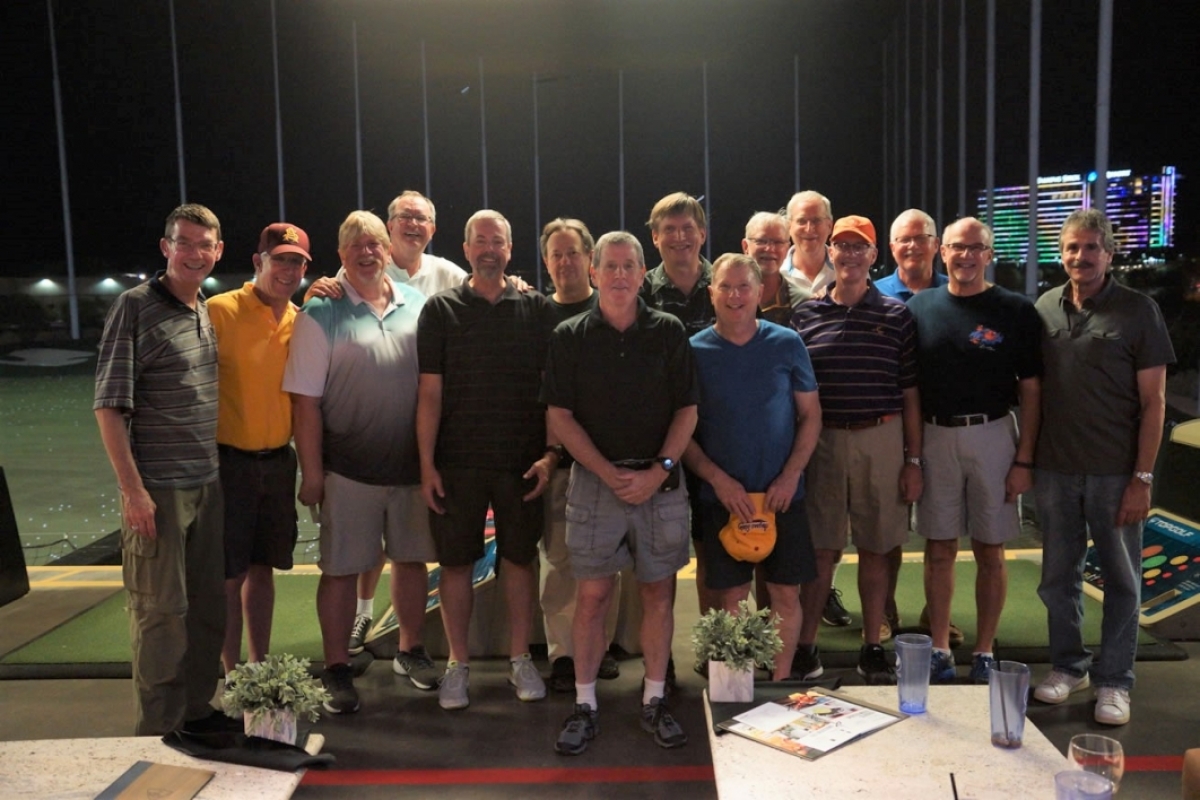 The 4NW stands together at Topgolf for their 2017 reunion.