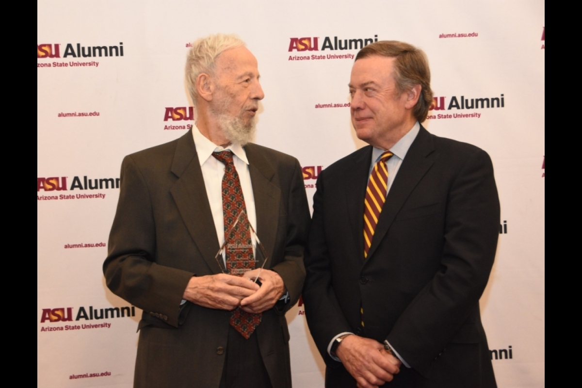 Two men smiling and speaking at ASU Founders' Day 2023.