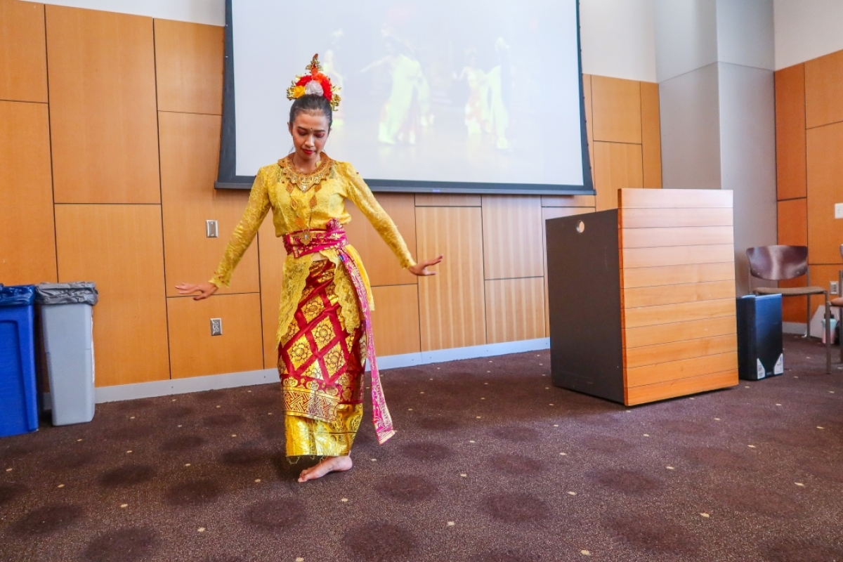 One of the students from Universitas Esa Unggul in Indonesia performing a traditional Indonesian dance at the graduation ceremony.