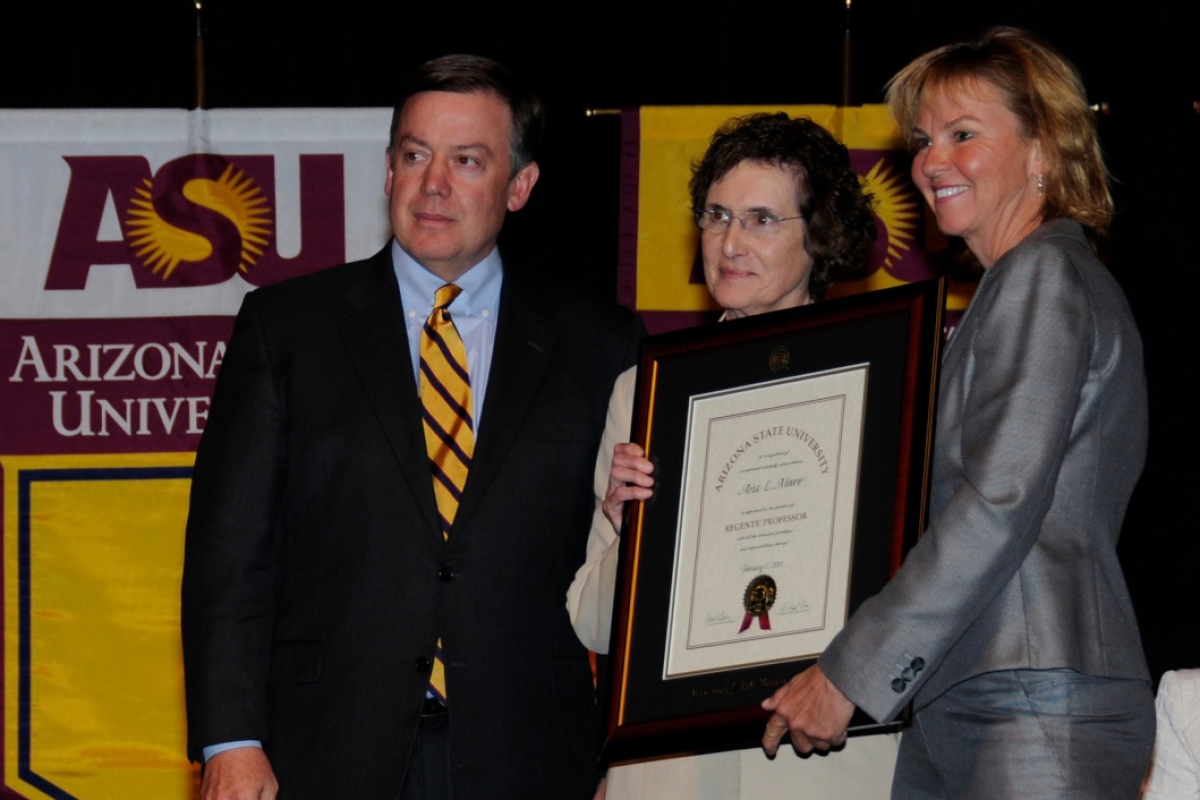 ASU Professor Ana Moore receiving a plaque at a ceremony where she was named a Regents Professor in 2011.