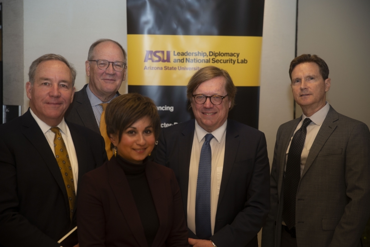 Five people standing in front of an ASU Leadership, Diplomacy and National Security Lab banner
