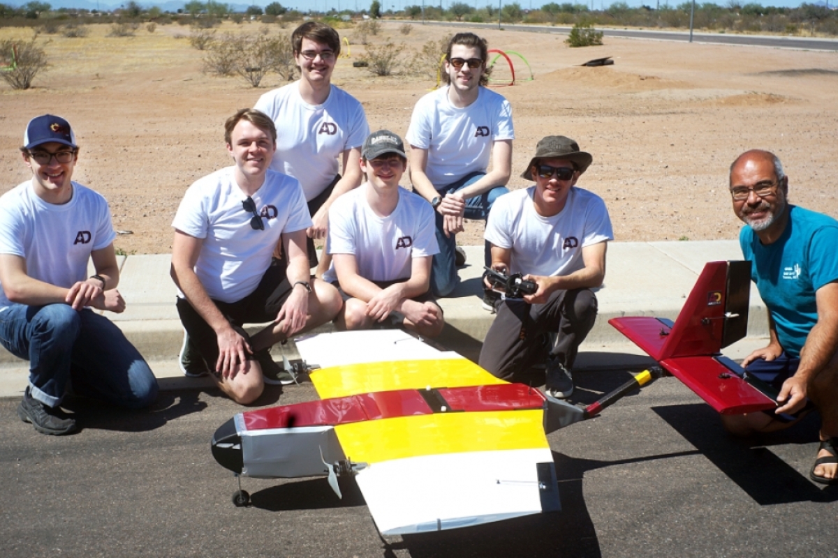 A photo of the Air Devils team member and their 2020-2021 AIAA Design/Build/Fly competition aircraft.