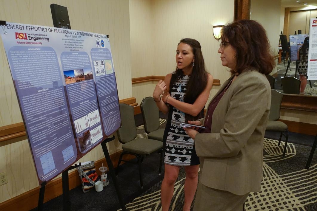 ASU graduate student Kayla DeVault discusses her research poster