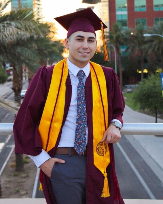 ASU College of Health Solutions graduate Jeremy Andia in his cap and gown