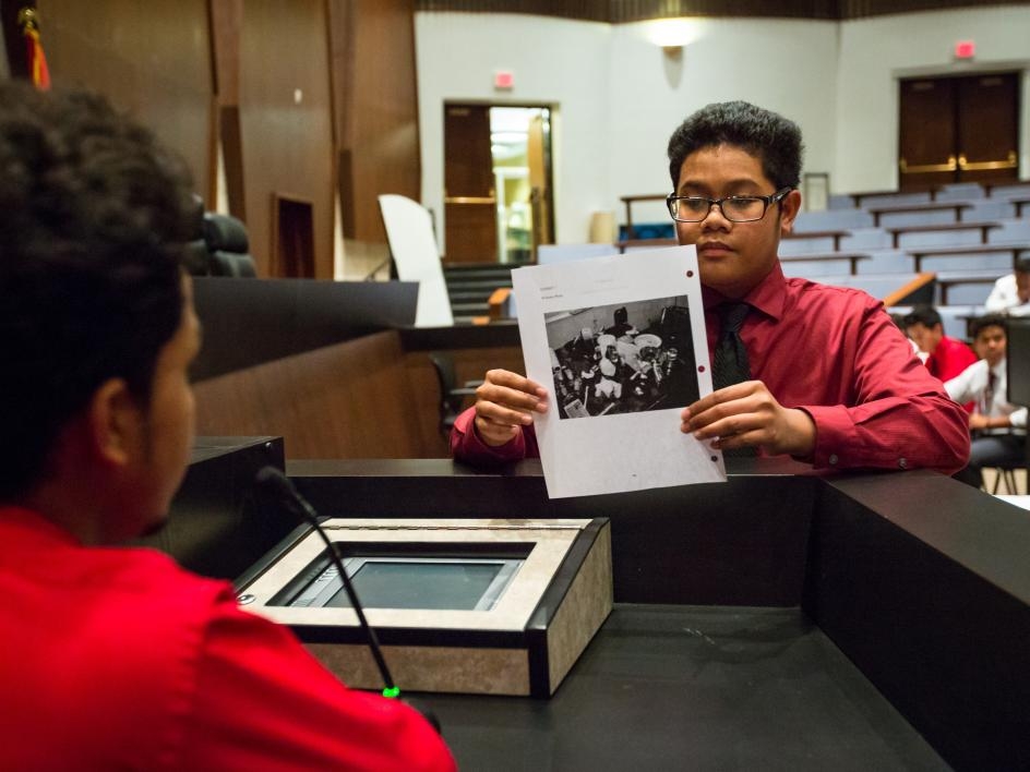 High schoolers present evidence at a mock trial at APACE Academy