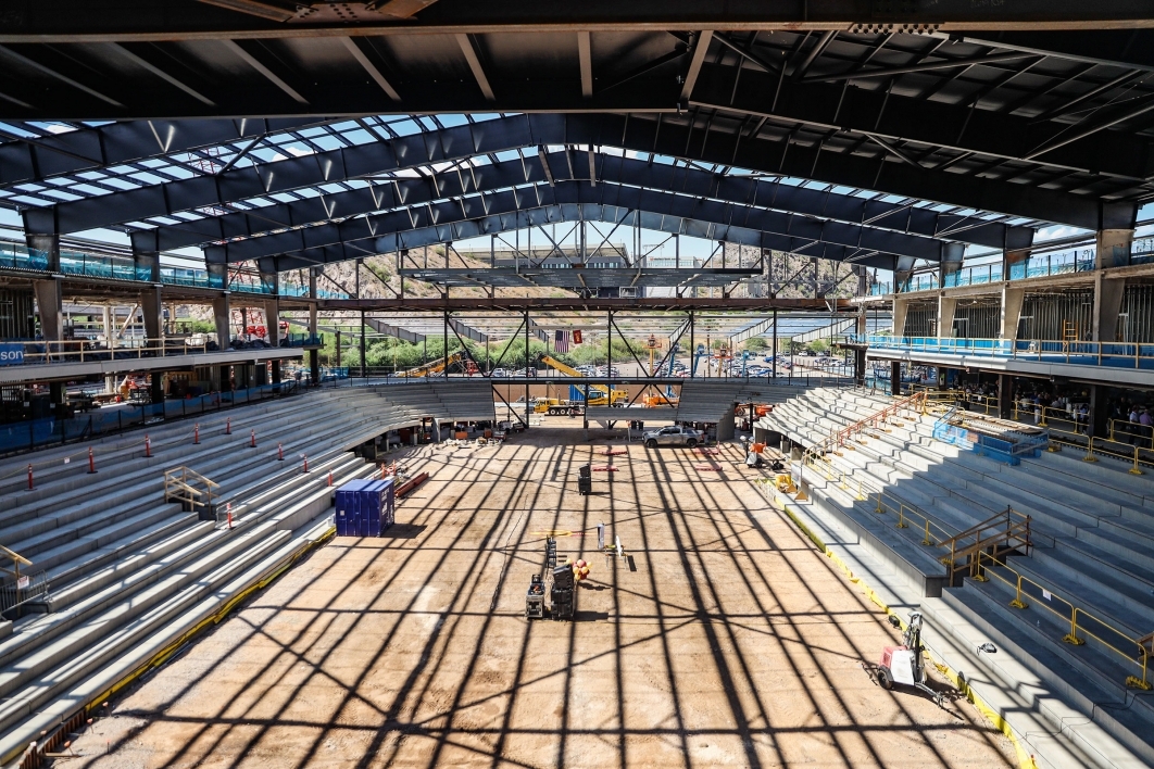 An arena under construction shows the beginning of bleachers