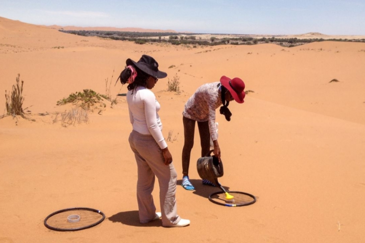 researchers measuring carbon dioxide release from the soil in the Namib Desert in southern Africa