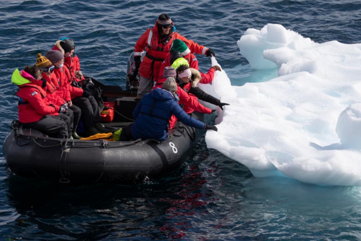 Group of ASU students ice hunting on a zodiac boat in Antarctica