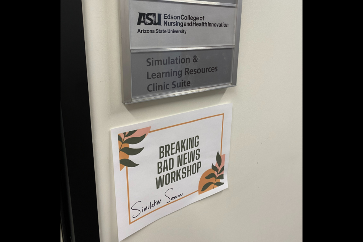 Two signs are shown one permanent which says, ASU Edson College of Nursing and Health Innovation Simulation & Learning Resources Clinic Suite. The second sign right below it reads, "Breaking Bad News Workshop" Simulation Scenario
