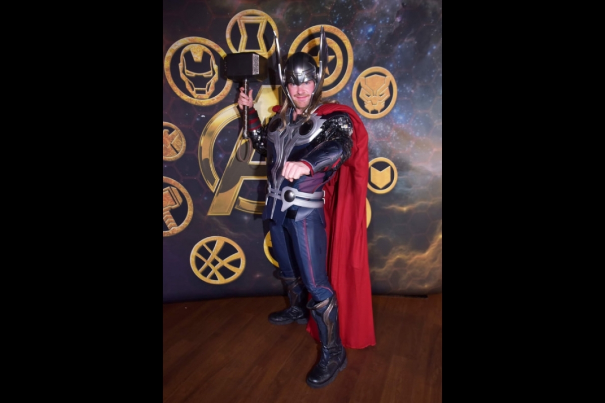 Man wearing a Thor costume.