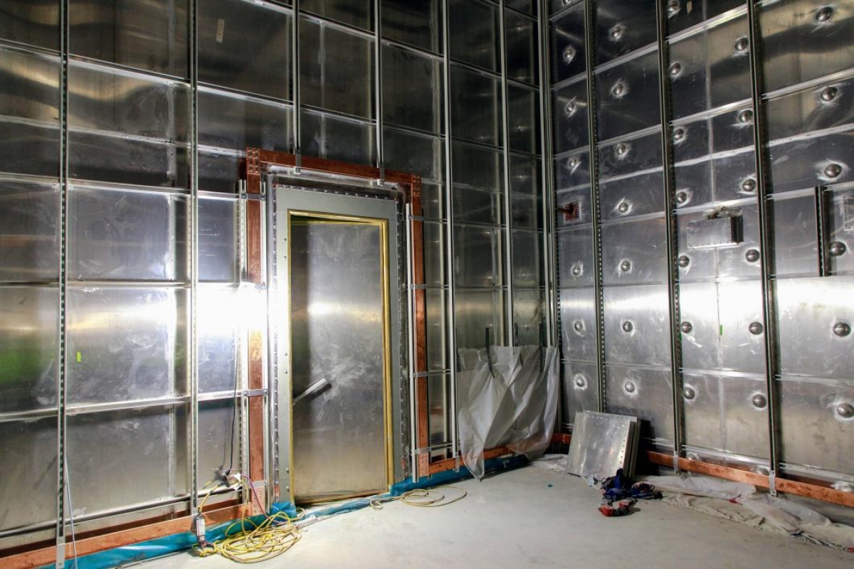 This vault's custom-welded paneling acts as a Faraday cage to shield the CXFEL.