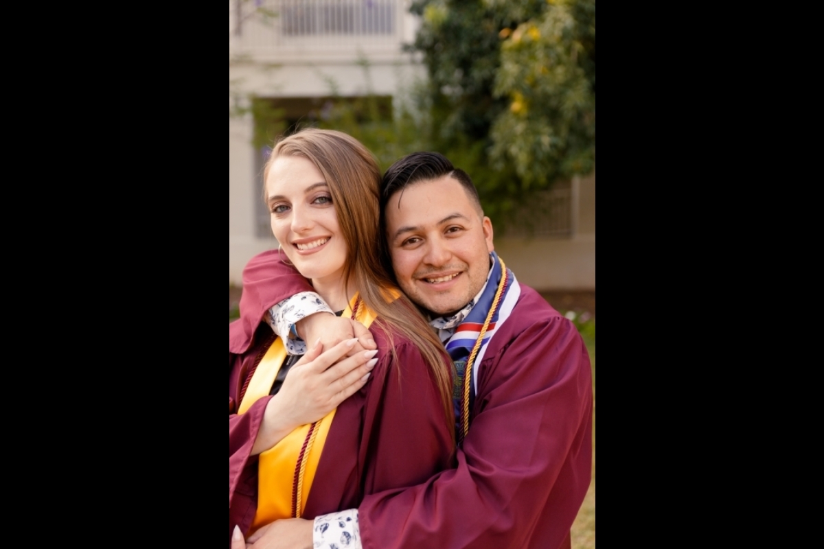 Portrait of ASU graduates Chelsea Patti and Alex Peraza wearing graduation regalia.