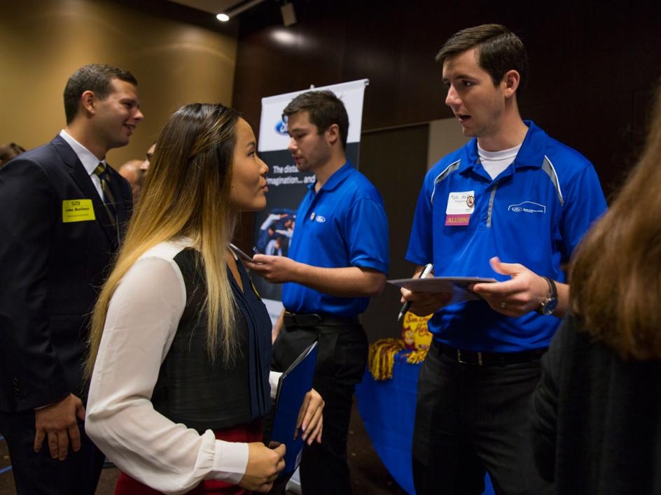 Mechanical engineering junior Erin Huber talks with a Ford Motor Company recruiter.