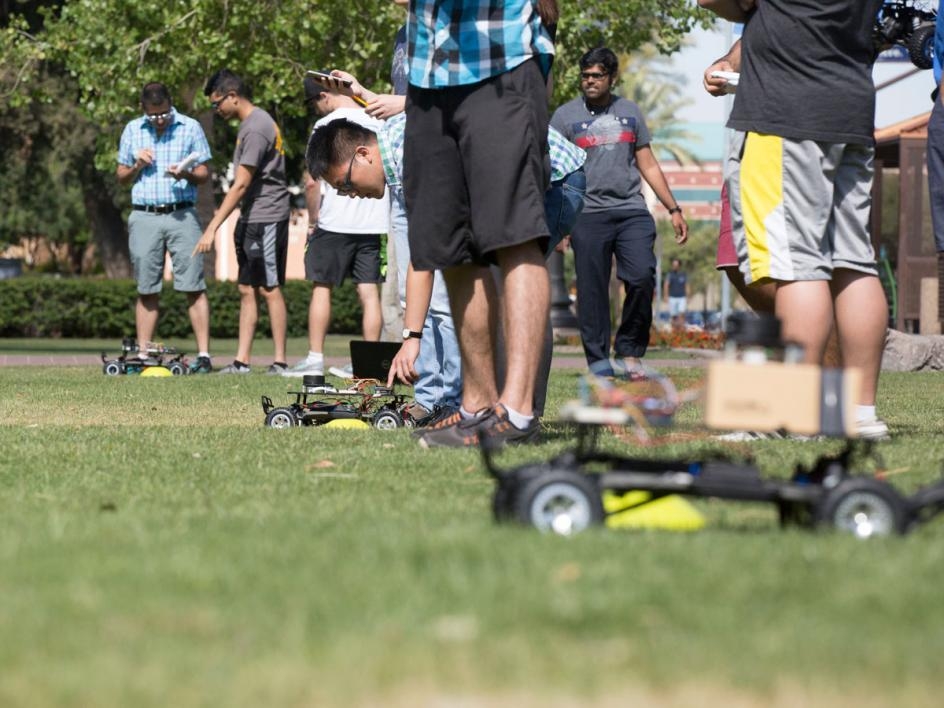 Teams line up for the final project of the semester — a race to earn some extra credit. Students competed at Old Main lawn in five heats of three teams, avoiding obstacles and navigating to a destination. Teams who reached the destination without hitting 
