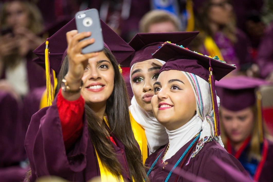graduates posing for selfie