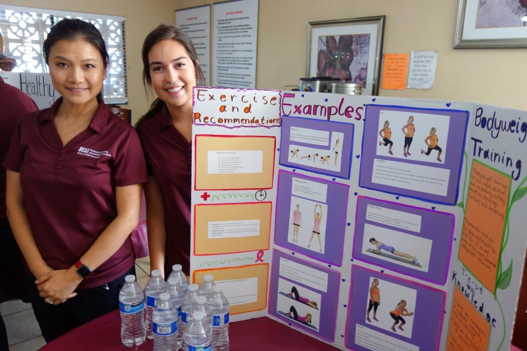 ASU nursing students pose with the poster they created for a health fair