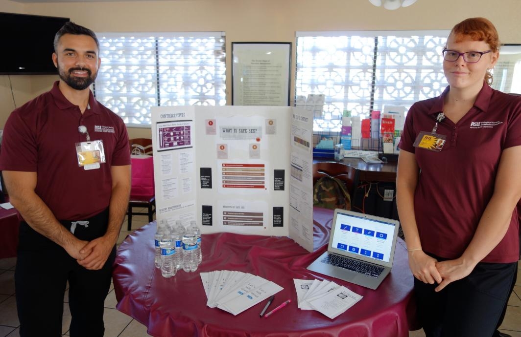ASU nursing students pose with the poster they created for a health fair