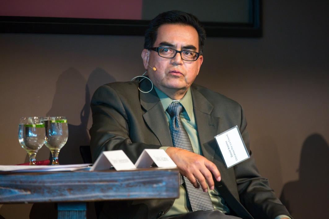 A man speaks during a discussion panel.