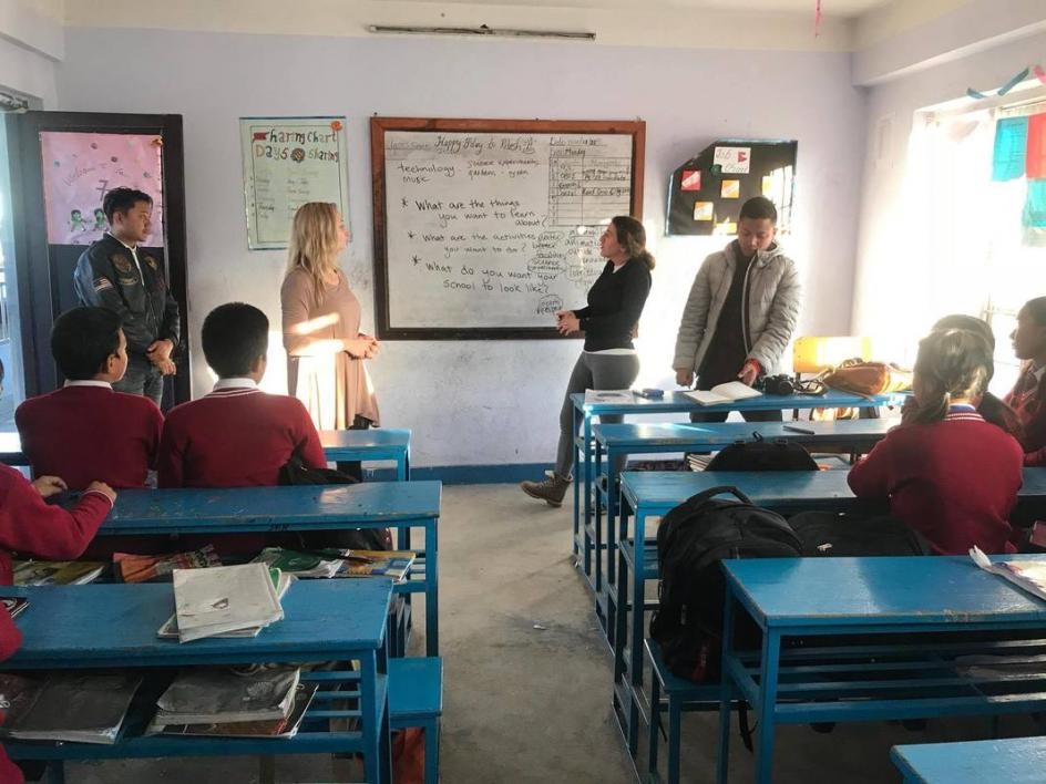 McDermott gives a presentation in a Nepalese classroom