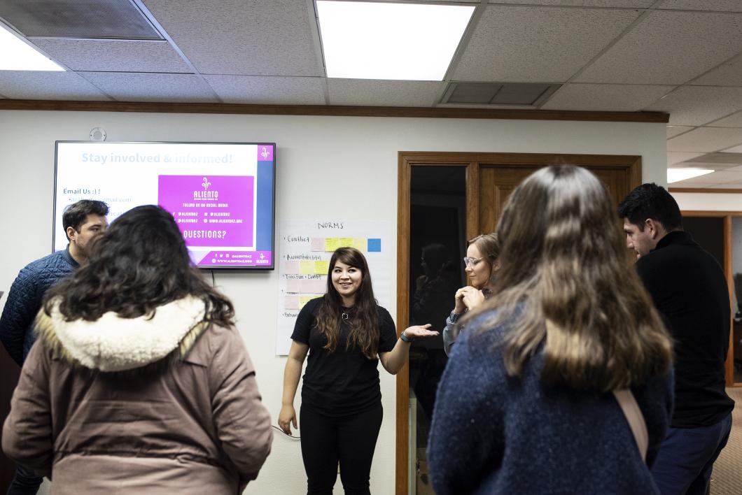 Aliento founder Reyna Montoya leads an informational meeting at the group's office in Mesa, Arizona.