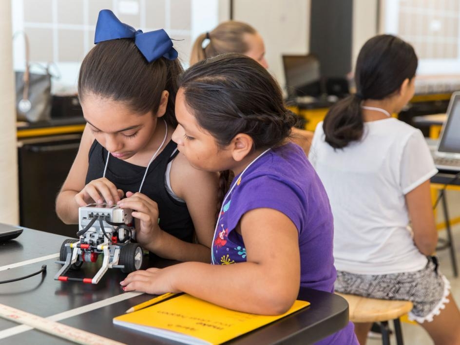 Girls build robots at Lego camp