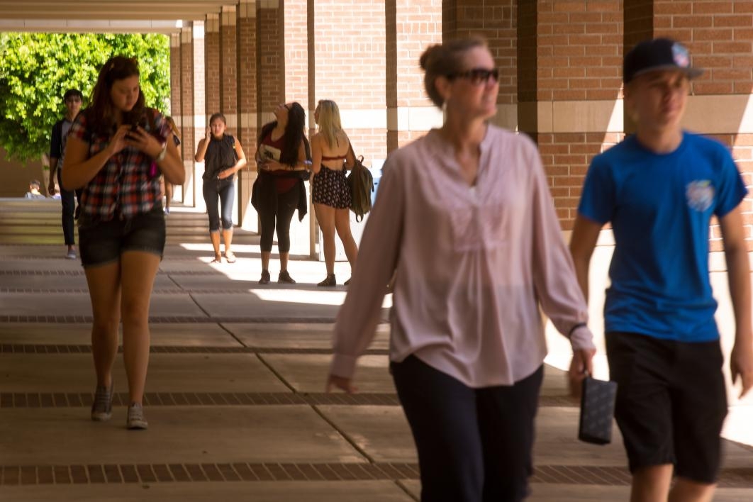 students walking through courtyard on campus