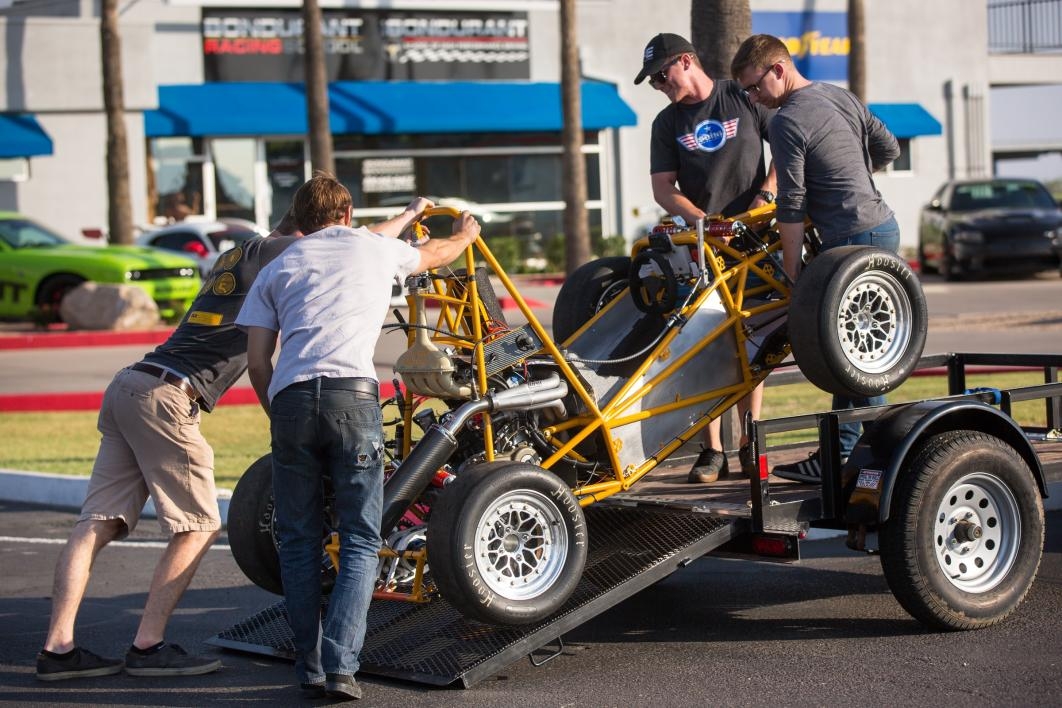 Students unload their race car at the test track.