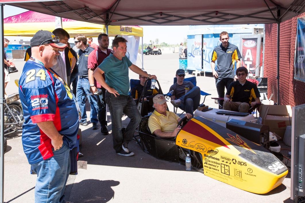 Race fans play with a car simulator at PIR.