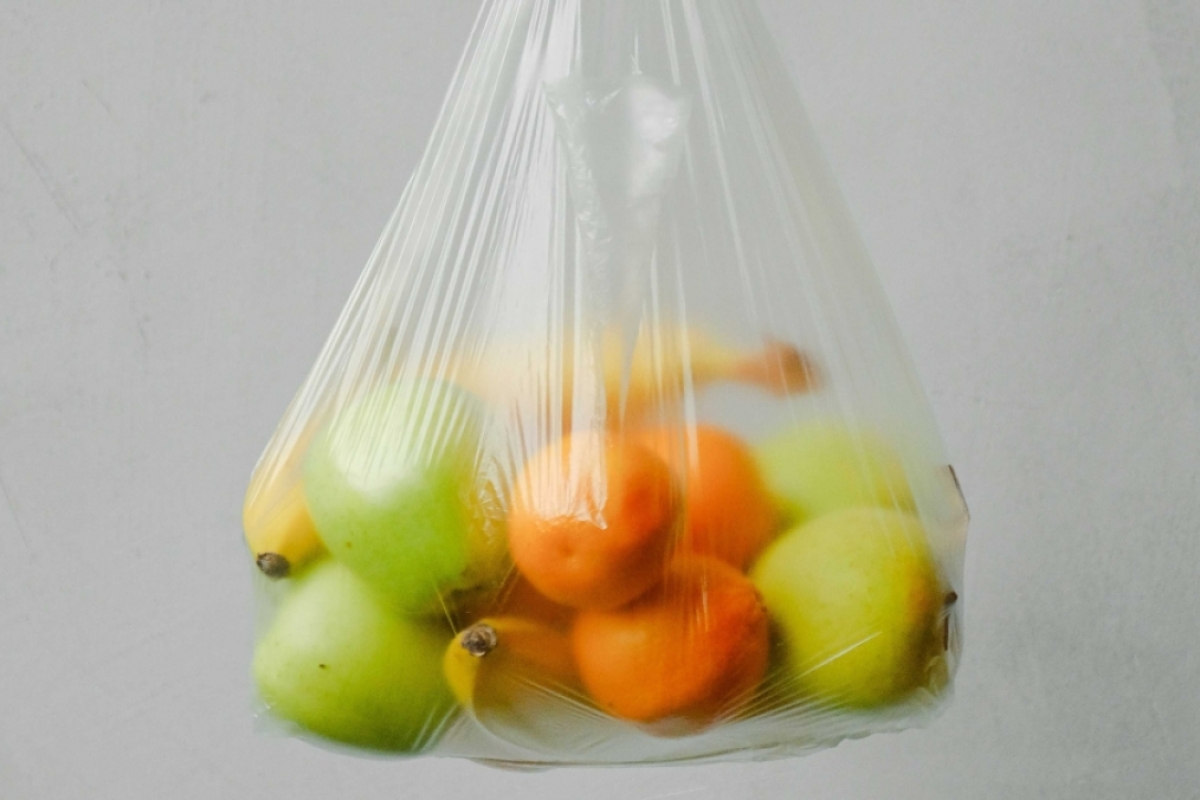 A variety of fruit in a plastic bag