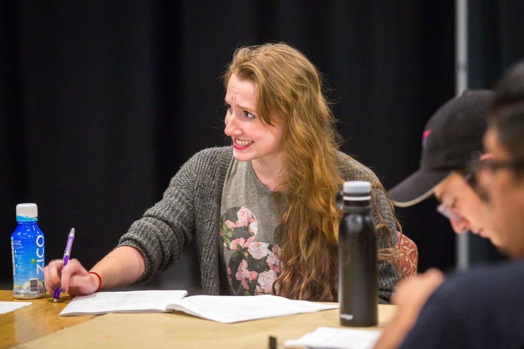 Student actors rehearse a play.