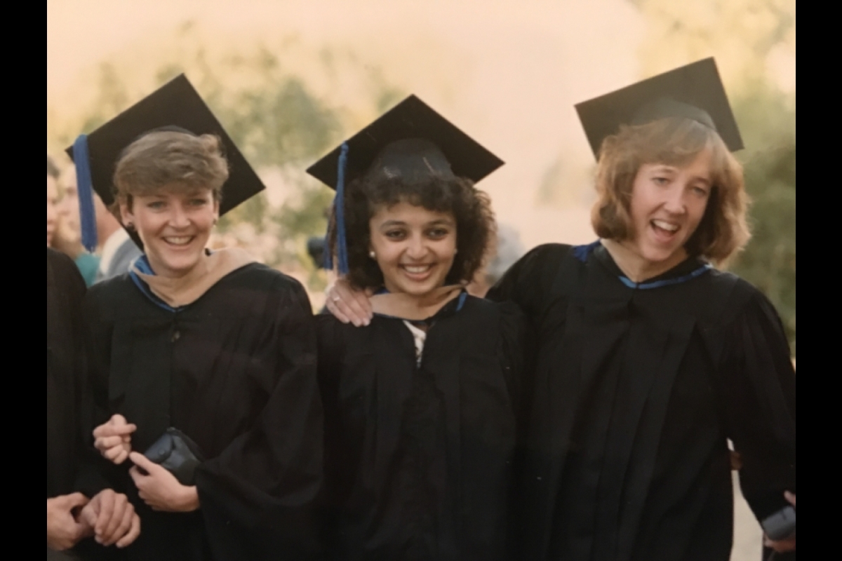 Sanjyot Dunung with fellow students at Thunderbird’s graduation in 1987 wearing graduation gowns and hats.