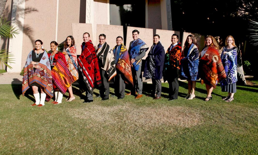 graduates posing after Indian blanket ceremony