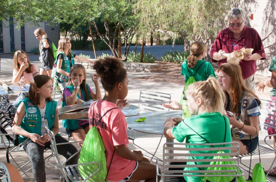 Girl Scouts eat s’mores made in solar ovens they built earlier in the day at ASU Polytechnic campus