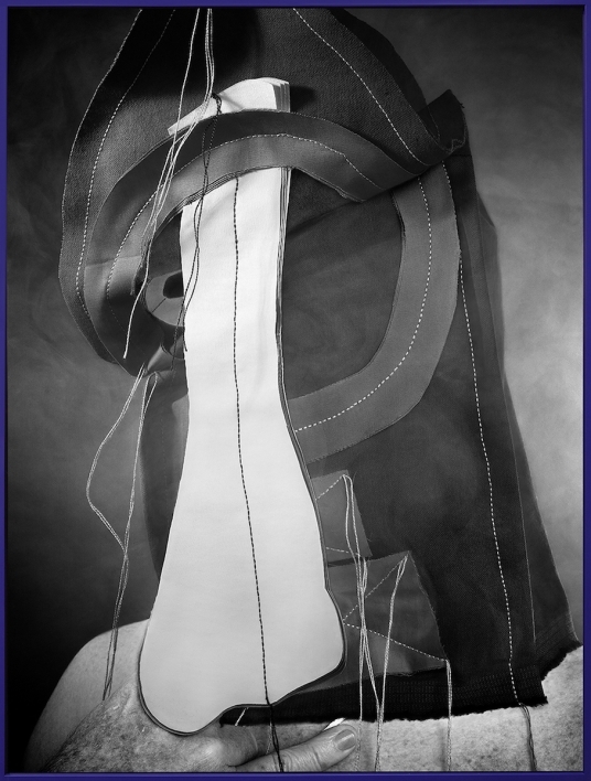 art photograph of white cloth intersecting with black cloth