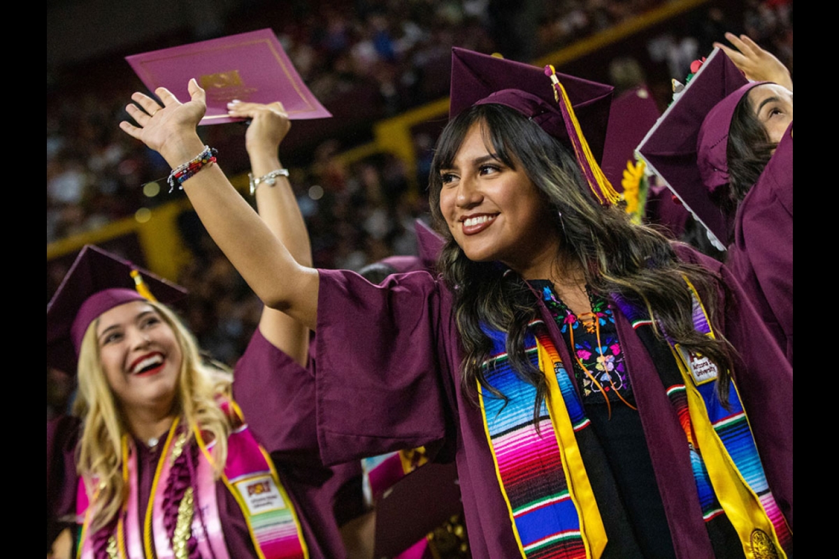 Graduates waving at Hispanic convocation