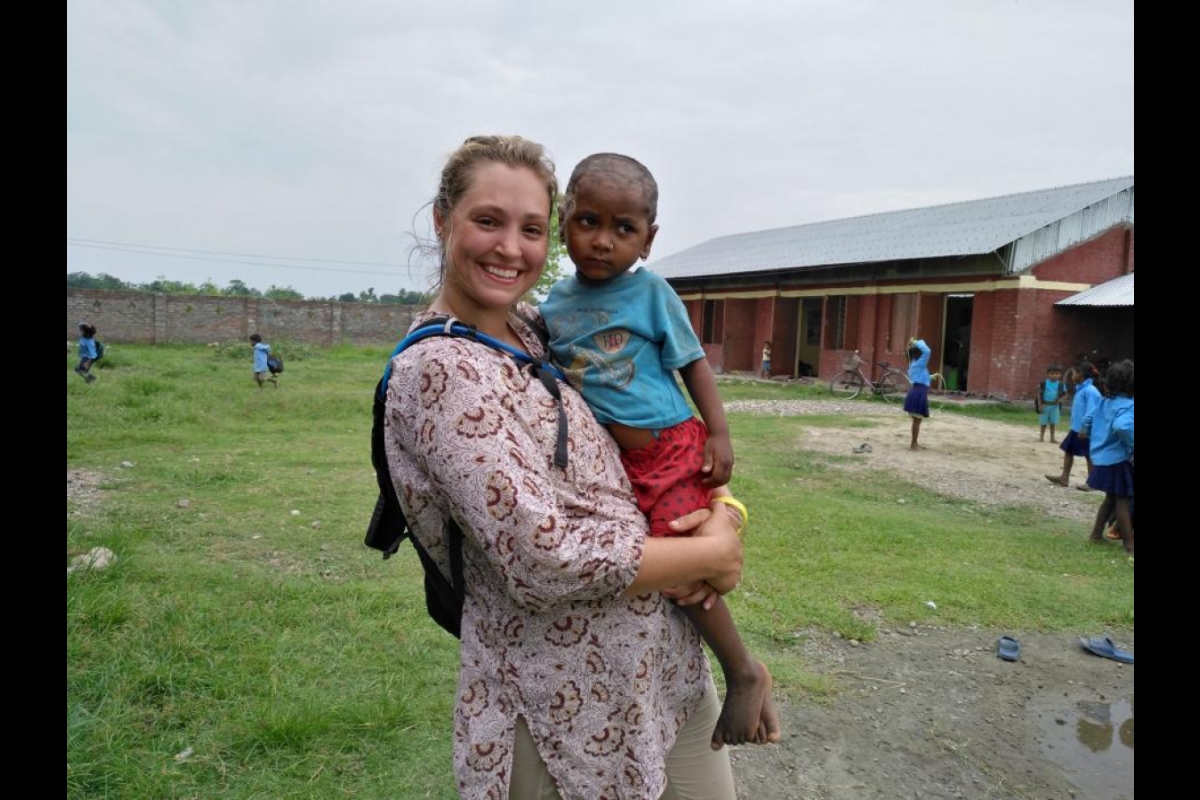 ASU student with Nepalese child
