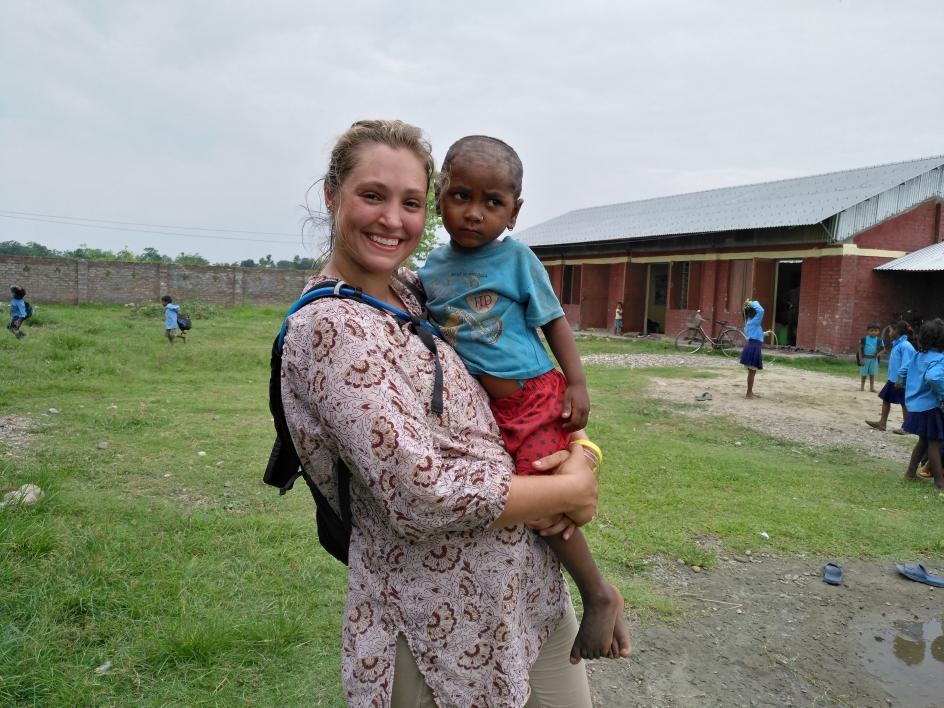 ASU student with Nepalese child