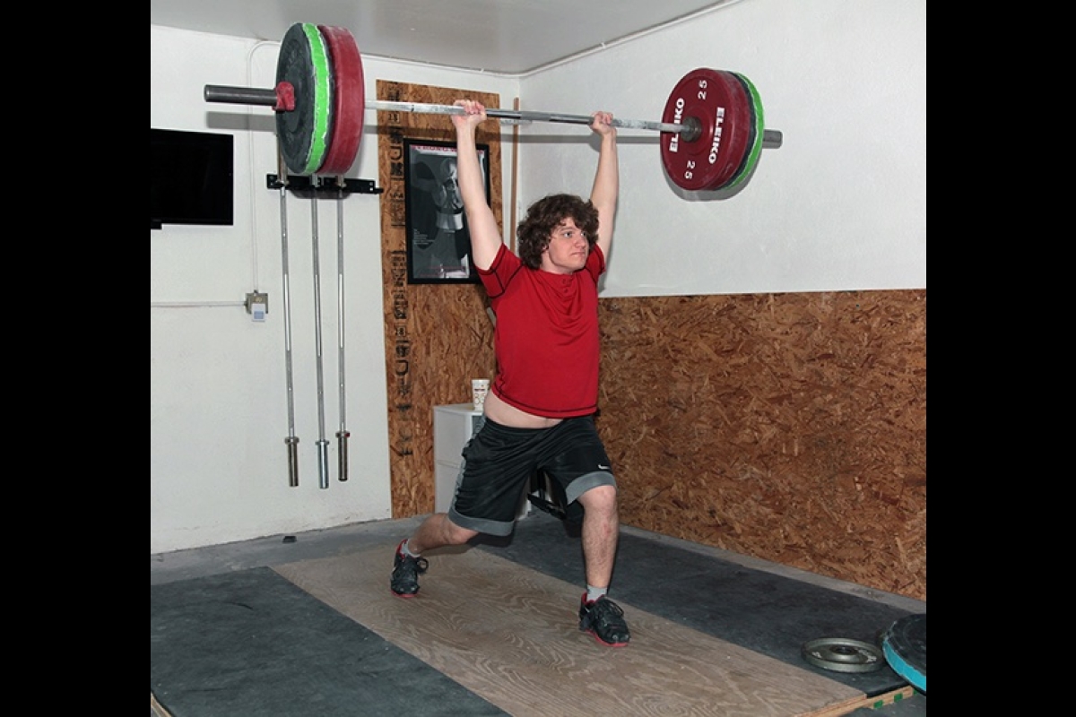 J.D. House performing a clean and jerk weightlifting move