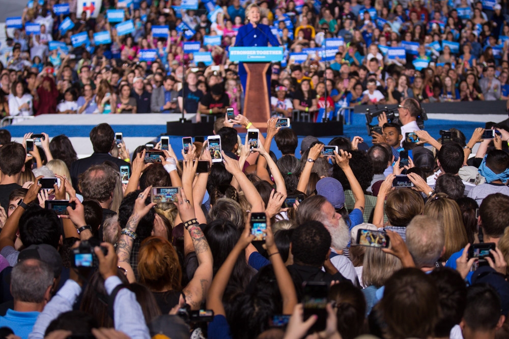 Fans take cell-phone photos of Clinton