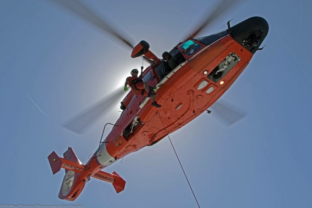 Coast Guard rescue swimmer lowered