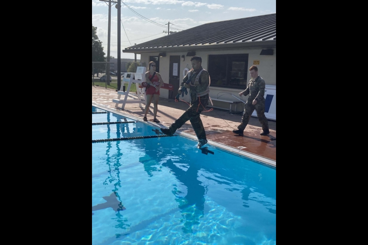 ASU Army ROTC Cadet Jose Gonzalez stepping into a swimming pool.