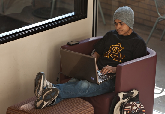 student relaxing with computer