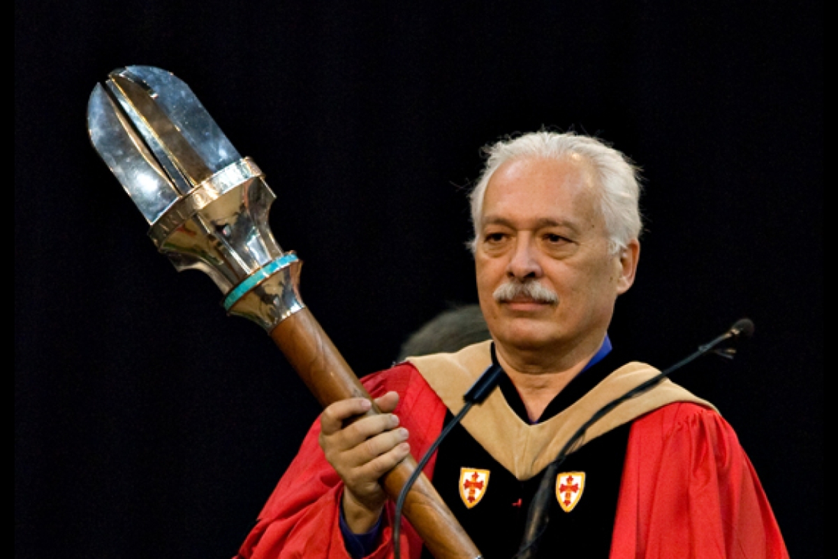 man holding university mace