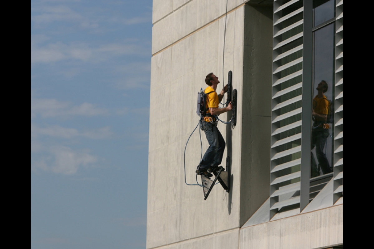 man climbing building at ASU Polytechnic