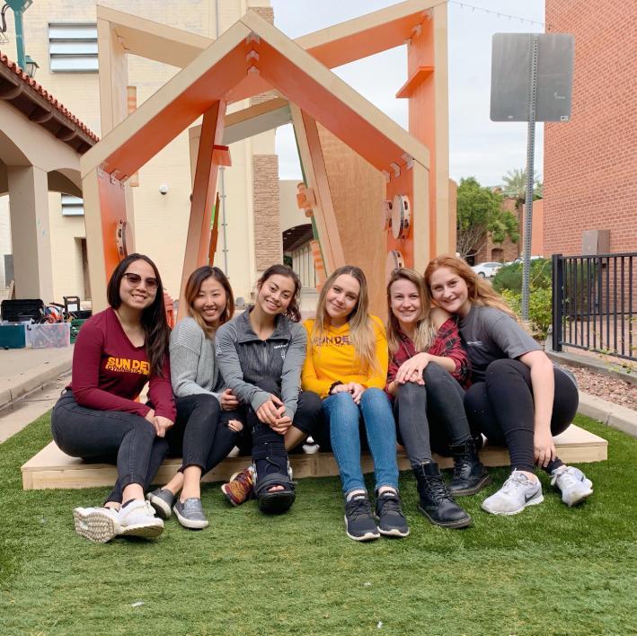 ASU design students pose with a structure they created for the Inter Play installation