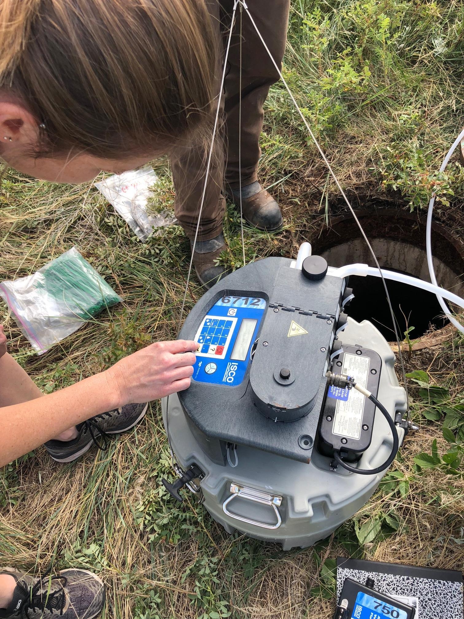 ASU researcher Erin Driver adjusts automated wastewater sampler