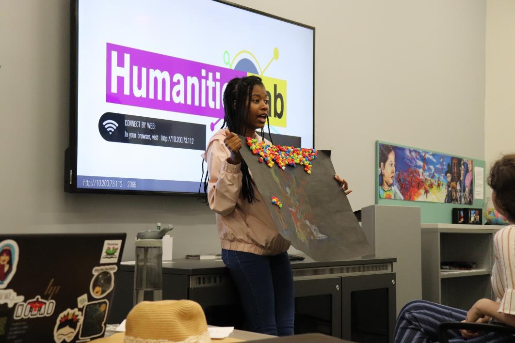 Student Shania Kemp presents her final project to the class.