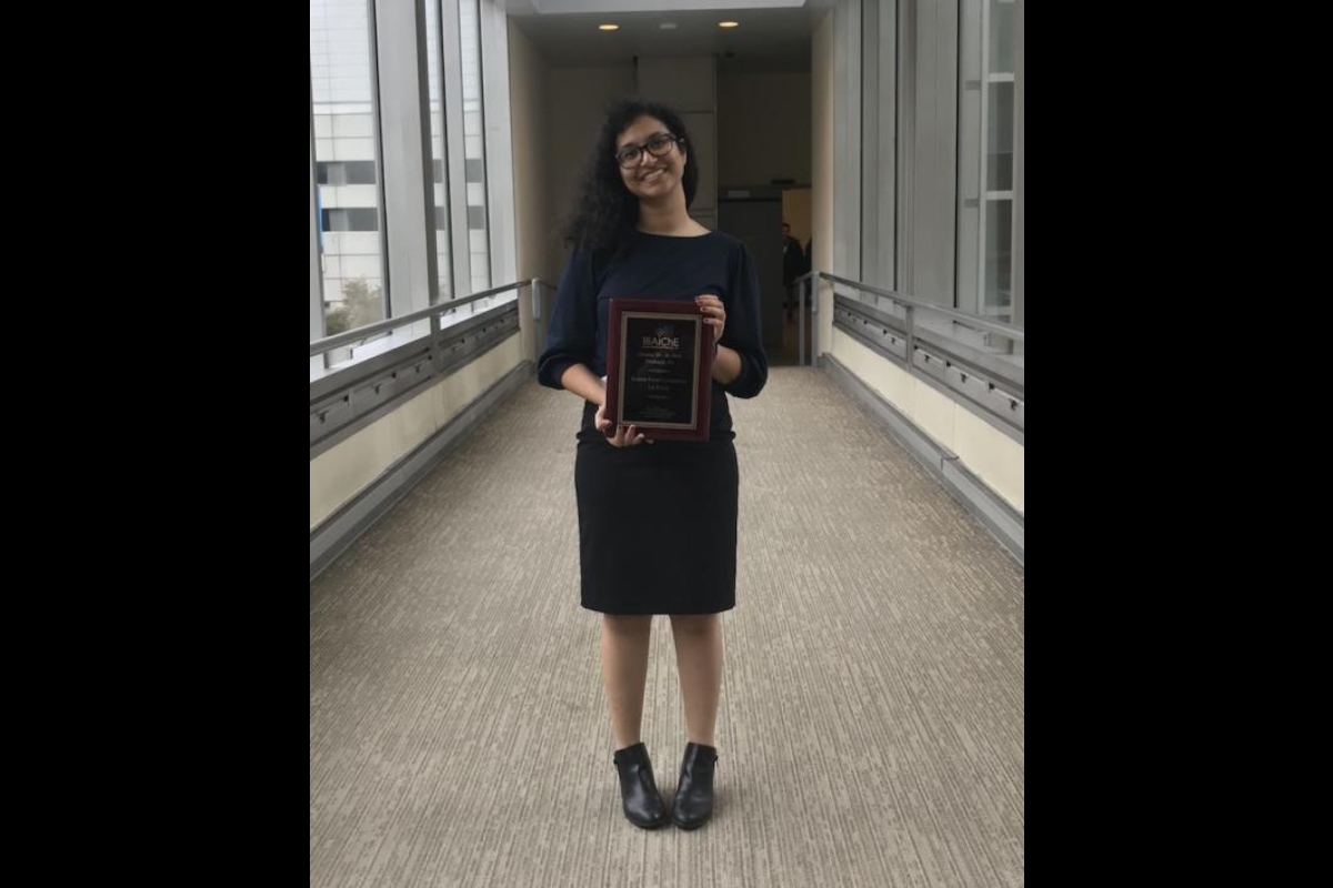 At the American Institute of Chemical Engineers Annual Student Conference, Ava Karanjia holds her first-place award for the student poster competition. 